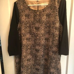 3/4 sleeve dress. Safari print with black sleeves.